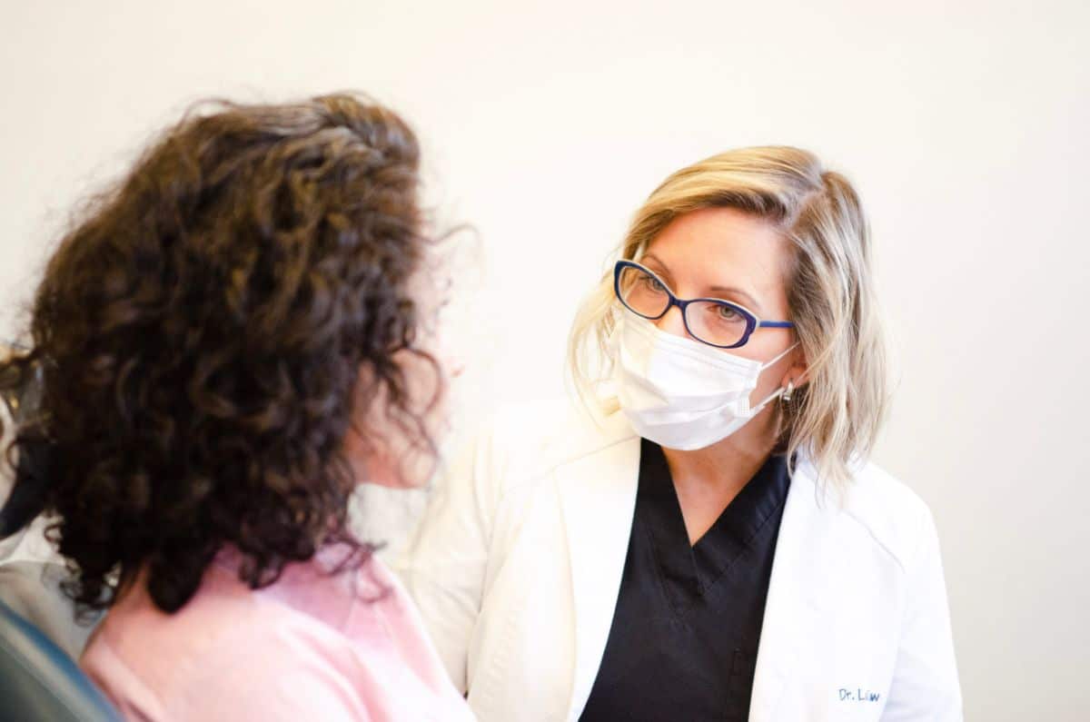 Dr. Laidlaw with patient
